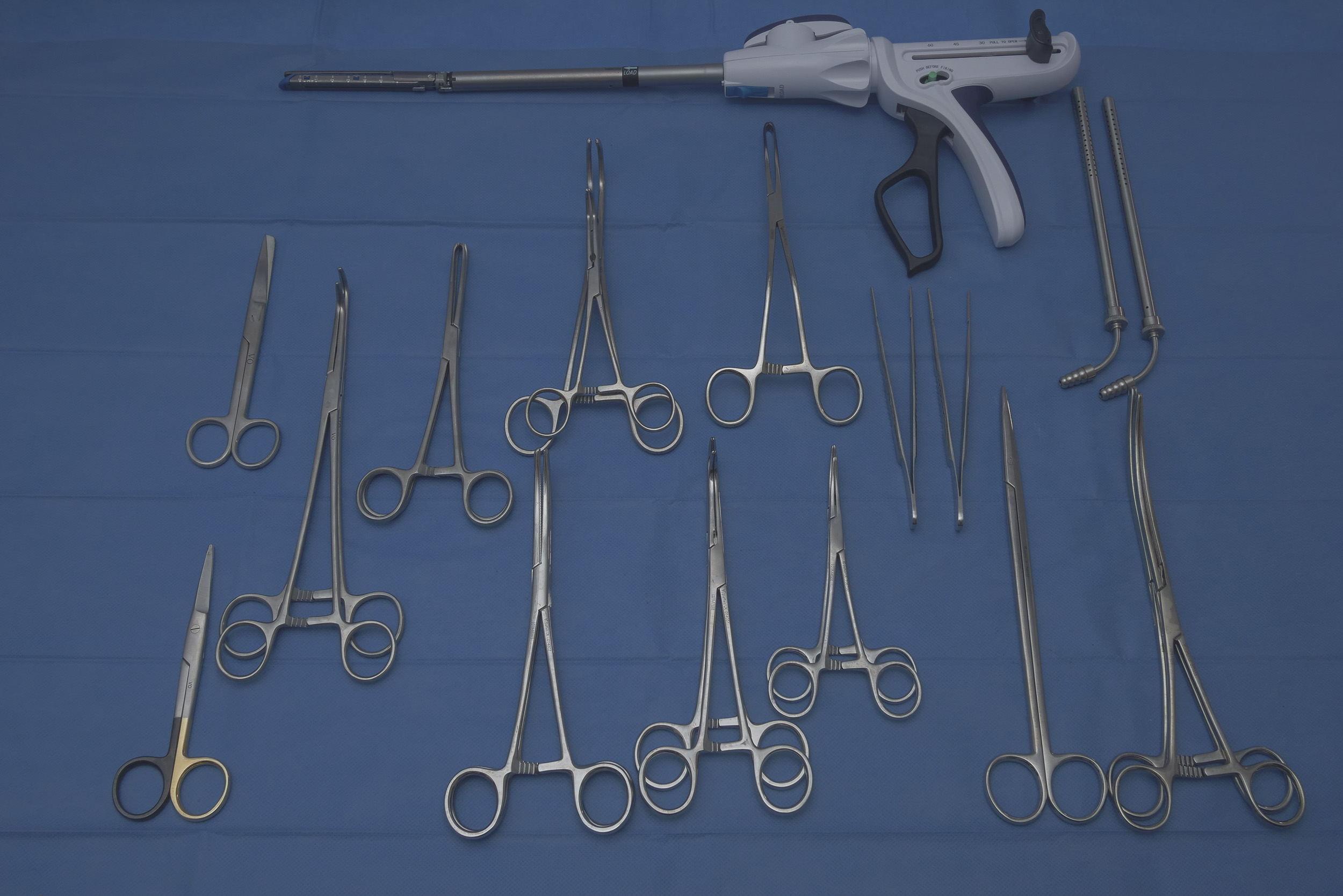 Comprehensive abdominal soft-tissue surgical instrument kit including forceps, retractors, needle holders, scissors, haemostats and laparotomy forceps used by Mainliacht for mobile veterinary surgery.